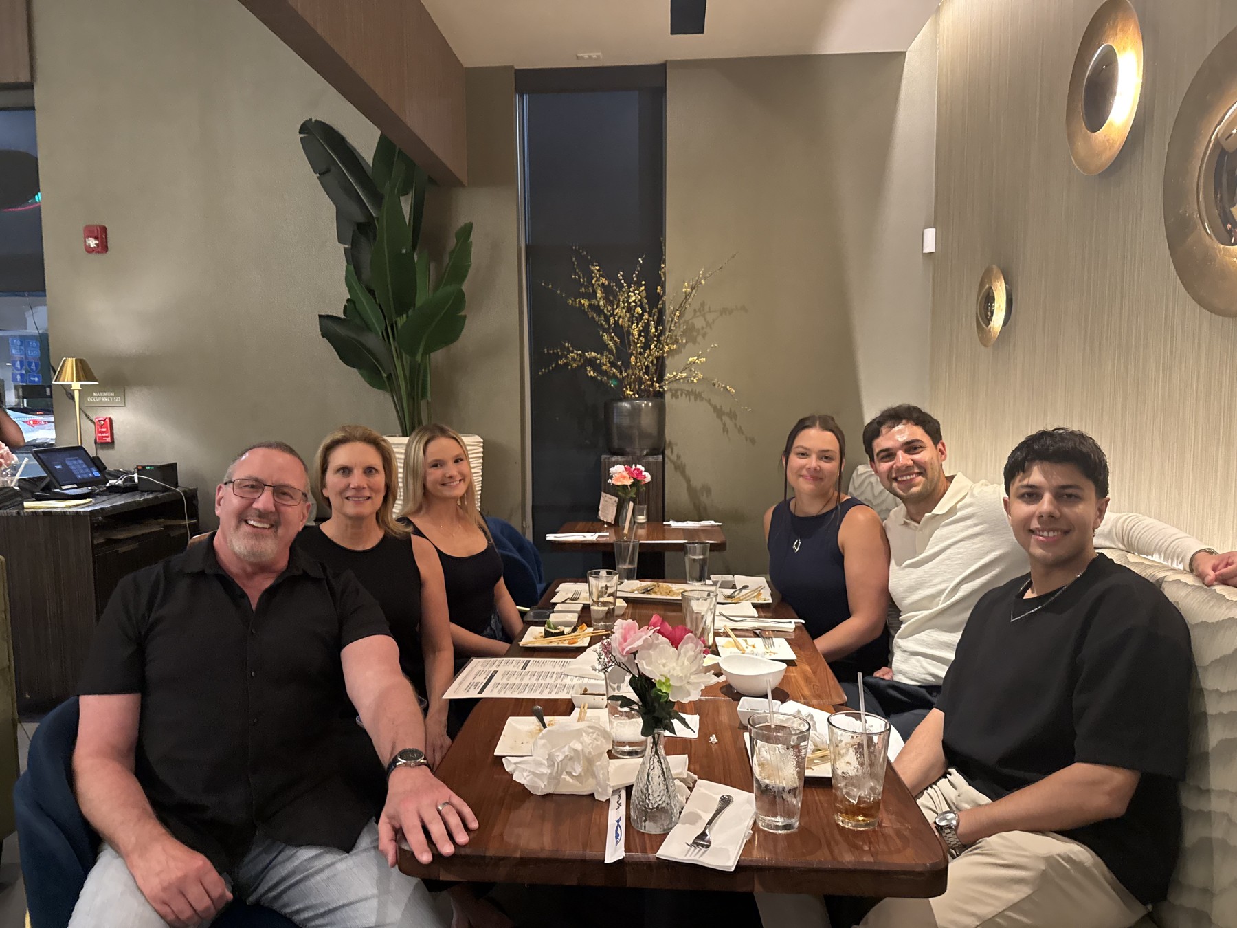 Passing of the Torch: New fellow Diego (middle right) at dinner with old fellow Abid and Dr. Levy's family